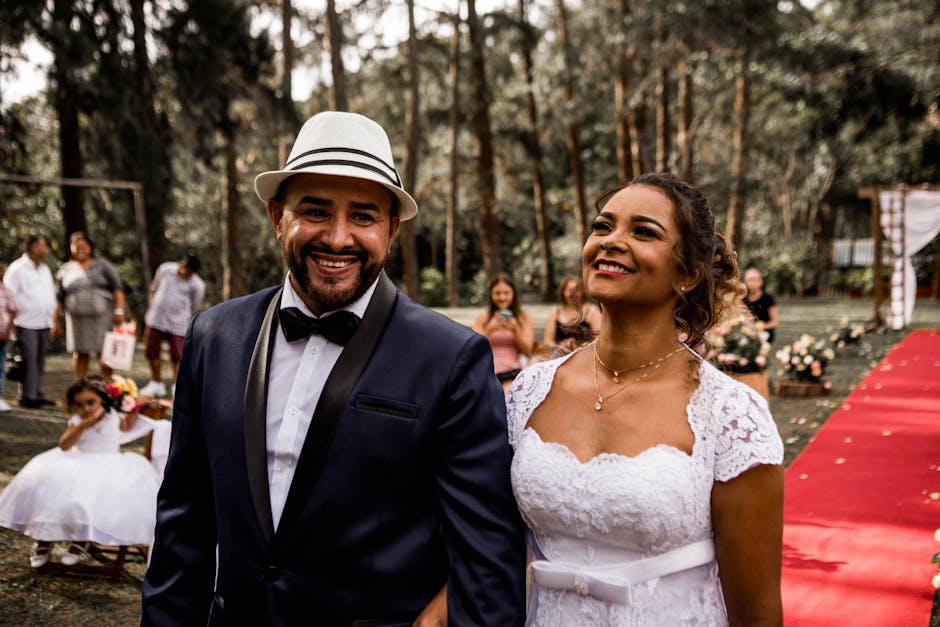 A happy bride and groom walking down the aisle outdoors during their wedding ceremony